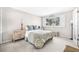 Bright bedroom featuring large windows, carpeted floors and calming neutral tones at 6497 Cape Hatteras Ne Way # 3, St Petersburg, FL 33702