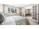 Comfortable bedroom with carpet, natural light, and double doors leading to another room at 6497 Cape Hatteras Ne Way # 3, St Petersburg, FL 33702