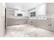 Kitchen area features white cabinets and a designated space for appliances at 6497 Cape Hatteras Ne Way # 3, St Petersburg, FL 33702