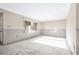 A bright living room featuring a large window and unfinished walls, ready for customization and renovation at 6497 Cape Hatteras Ne Way # 3, St Petersburg, FL 33702
