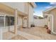 A spacious, light-filled back patio with tiled flooring and views of the landscaped backyard at 6497 Cape Hatteras Ne Way # 3, St Petersburg, FL 33702