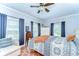 Cozy bedroom featuring a ceiling fan, natural light and decorative accents at 713 W Kentucky Ave, Tampa, FL 33603