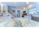 Spacious kitchen with granite counters, modern appliances, white cabinetry, and stylish decor at 713 W Kentucky Ave, Tampa, FL 33603
