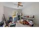 A bedroom featuring a ceiling fan and a window allowing natural light at 7537 Old Pasco Rd, Wesley Chapel, FL 33544