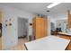 Spacious kitchen leading to a bathroom and living room area at 7537 Old Pasco Rd, Wesley Chapel, FL 33544