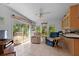 Bright and airy living room with sliding glass doors leading to the outdoor deck at 7537 Old Pasco Rd, Wesley Chapel, FL 33544