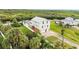 Stunning waterfront home boasts lush landscaping, a private dock, and convenient garage access, set against tranquil water views at 8932 Rocky Creek Dr, Tampa, FL 33615
