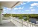 Relaxing balcony showcasing scenic waterfront views of lush greenery and blue skies at 8932 Rocky Creek Dr, Tampa, FL 33615