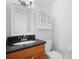 Bathroom featuring a wood cabinet with granite countertop at 8932 Rocky Creek Dr, Tampa, FL 33615