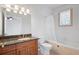 Bathroom featuring granite countertop, vanity, tub and shower at 8932 Rocky Creek Dr, Tampa, FL 33615