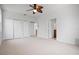 Spacious bedroom features plush carpeting and multiple closets at 8932 Rocky Creek Dr, Tampa, FL 33615
