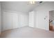 Spacious bedroom featuring wall closets, storage, and neutral carpet at 8932 Rocky Creek Dr, Tampa, FL 33615