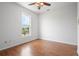 Bedroom featuring wood floors, natural lighting, and a ceiling fan at 8932 Rocky Creek Dr, Tampa, FL 33615