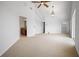 Vaulted ceiling bedroom with ensuite bathroom access, carpet, and walk-in closet at 8932 Rocky Creek Dr, Tampa, FL 33615