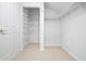 Well-organized walk-in closet with adjustable wire shelving and ample storage space at 8932 Rocky Creek Dr, Tampa, FL 33615