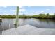 This waterfront property features a private dock with a scenic view of the river at 8932 Rocky Creek Dr, Tampa, FL 33615