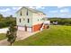 A beautiful two-story home featuring an attached three-car garage at 8932 Rocky Creek Dr, Tampa, FL 33615