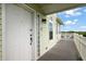 View of the exterior with wood flooring, and the front door showing the home's inviting entrance at 8932 Rocky Creek Dr, Tampa, FL 33615