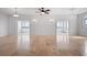 Spacious living area featuring tile floors and access to outdoor balconies at 8932 Rocky Creek Dr, Tampa, FL 33615