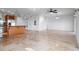 Open living area with tile floors and views of the kitchen and other rooms at 8932 Rocky Creek Dr, Tampa, FL 33615