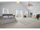 Spacious main bedroom with vaulted ceiling, large windows and access to balcony at 8932 Rocky Creek Dr, Tampa, FL 33615
