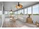 Bright and airy sunroom featuring a cozy seating area and nature views at 8932 Rocky Creek Dr, Tampa, FL 33615