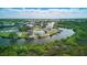 Aerial view of waterway with the two story duplex and surrounding landscape at 8940 Rocky Creek Dr, Tampa, FL 33615