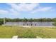 Backyard featuring canal and pier at 8940 Rocky Creek Dr, Tampa, FL 33615