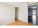 Spacious bedroom featuring wood-look flooring and neutral wall color at 8940 Rocky Creek Dr, Tampa, FL 33615