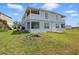Blue two-story home with a large backyard at 8940 Rocky Creek Dr, Tampa, FL 33615