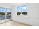Living room with large windows overlooking water and lush greenery at 8940 Rocky Creek Dr, Tampa, FL 33615