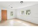 Bright, spacious room featuring a door and 3 windows at 8940 Rocky Creek Dr, Tampa, FL 33615