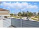 Street view from the balcony of the duplex featuring green lawns and parked vehicles at 8940 Rocky Creek Dr, Tampa, FL 33615