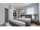 Bedroom boasts gray flooring, natural light, and a walk-in closet for ample storage at 10728 Navigation Dr, Riverview, FL 33579