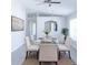 Airy dining room featuring modern decor, a glass table set and plenty of natural light at 10728 Navigation Dr, Riverview, FL 33579