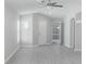 Spacious living room with bright neutral paint and new gray wood-look flooring at 10728 Navigation Dr, Riverview, FL 33579