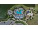 Aerial view of community amenities featuring a resort style pool, clubhouse, playgrounds, and more at 11773 Little River Way, Parrish, FL 34219