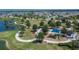 Brightwood at North River Ranch park aerial view showcasing playground, sports field, and walking trail by the pond at 11773 Little River Way, Parrish, FL 34219