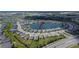 Aerial view showcasing a home's location on a lake, surrounded by a well-planned community at 11773 Little River Way, Parrish, FL 34219