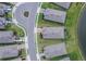 A high angle, aerial view showcasing a home situated on a well-maintained cul-de-sac with access to a lake at 11773 Little River Way, Parrish, FL 34219