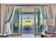 Patio with sliding glass doors, showcasing scenic lake views and outdoor seating at 11773 Little River Way, Parrish, FL 34219