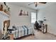 Bedroom featuring ceiling fan, window and desk at 11773 Little River Way, Parrish, FL 34219