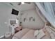 Charming bedroom with a vanity, TV, and a cozy canopy bed at 11773 Little River Way, Parrish, FL 34219