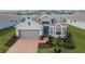 Charming single-Gathering home with a two-car garage, bay windows, and a neatly landscaped front yard at 11773 Little River Way, Parrish, FL 34219
