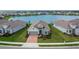Single-Gathering home with a two-car garage and bay windows, situated in a lakeside community at 11773 Little River Way, Parrish, FL 34219