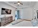 Bright main bedroom featuring tray ceilings, neutral walls, and an inviting Primary bathroom at 11773 Little River Way, Parrish, FL 34219