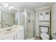Bathroom featuring a step-in shower and built-in shelving at 122 N Kings Ave # 101, Brandon, FL 33510