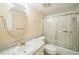 Functional bathroom featuring a single sink vanity, an oval mirror, and a shower-tub combination at 122 N Kings Ave # 101, Brandon, FL 33510
