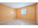 Simple bedroom with tile flooring, standard window, and neutral paint perfect for personalization at 122 N Kings Ave # 101, Brandon, FL 33510