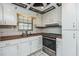 Functional kitchen with stainless steel appliances and ample counter space at 122 N Kings Ave # 101, Brandon, FL 33510